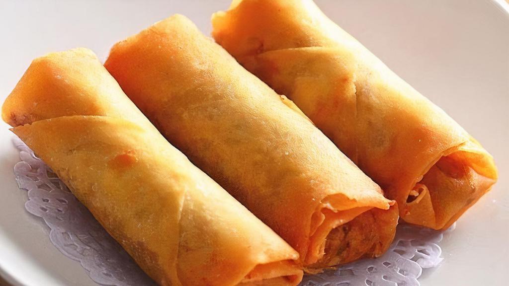 Spring Rolls (2) · Freshly shredded cabbage, green onions, and carrots mixed with rice noodles wrapped in pastry served with plum sauce.