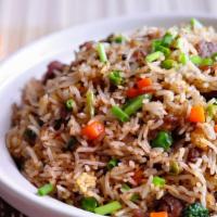 Chinese Fried Rice · Stir-fried eggs, green & white onions, peas & carrots mixed with rice