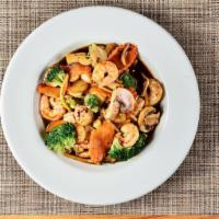 Pad Pak (Vegetable Delight) · Stir-fried broccoli, carrot, mushroom, water chestnut, bamboo slice, and baby corn with brow...