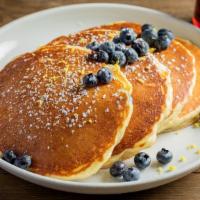 Buttermilk Pancakes · Four stack of pancakes, served with a side of grade a pure maple syrup and butter.