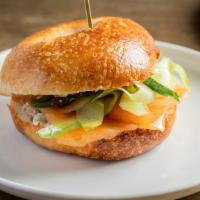 Gravlax Bagel · House cured salmon, herb cream cheese and cucumbers.