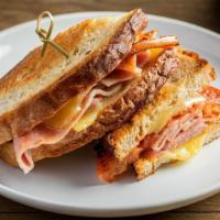 Grilled Ham & Cheese · Ham of the bone, gruyere and tomato on a country white bread by default.