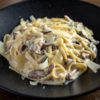 Wild Mushroom Alfredo · Fettuccine pasta, homemade alfredo sauce, mushrooms and parmesan.