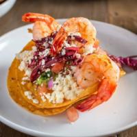 Shrimp Tostada · Grilled argentine shrimp, pico de gallo, guac, queso fresco, and corn tortilla.
