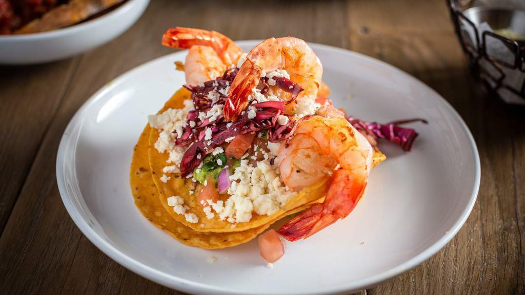 Shrimp Tostada · Grilled argentine shrimp, pico de gallo, guac, queso fresco, and corn tortilla.