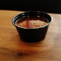 Ginger Sauce · Individual portion of our soy based housemade sauce.. ALLERGENS: soy, wheat/gluten