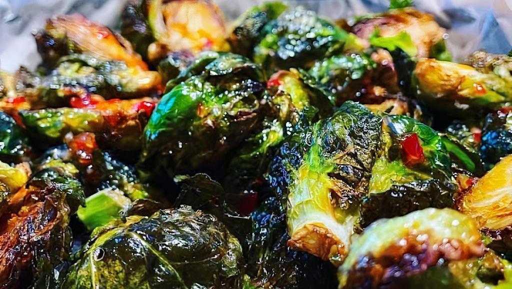 Brussel Sprouts · Crispy fried sprouts drizzled with sweet tai chili sauce.