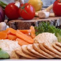 Hummus Trio · Original garlic and roasted red pepper. served with fresh veggies and crackers.