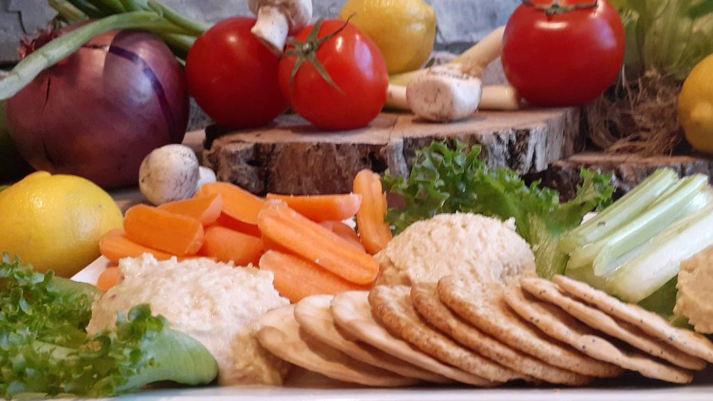 Hummus Trio · Original garlic and roasted red pepper. served with fresh veggies and crackers.