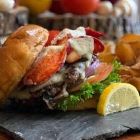 Lobster Burger · Our spin on surf 'n' turf a 1/2 lb angus steak burger topped with hot lobster aioli lettuce ...