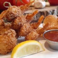 Coconut Shrimp Platter · A basket of 8 crispy jumbo shrimp served with sweet chili sauce and housemade chips