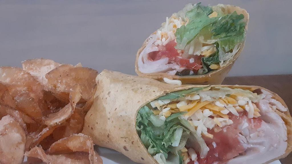 Deli Wrap · Fresh turkey breast or ham served cold with lettuce tomato and cheddar jack cheese
