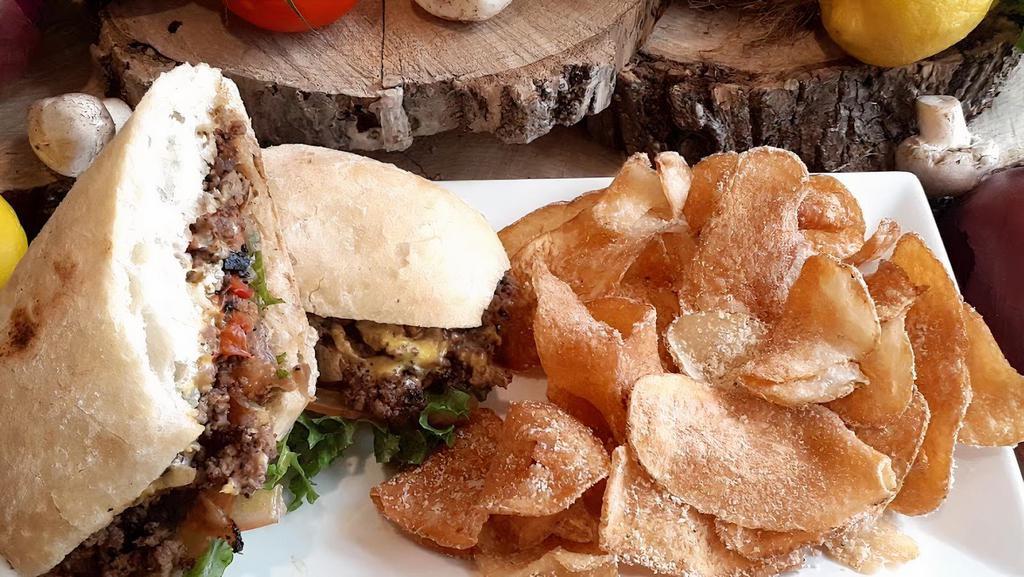 Chopped Cheese · A new york deli classic our 1/2 lb angus steak burger hashed and sautéed with onions and green peppers and american cheese topped with lettuce and tomato. served on a hoagie roll.