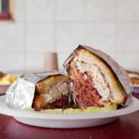 Reuben Sandwich · Corned beef, 1000 island, Swiss cheese and sauerkraut served on grilled rye.