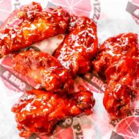 Wing Dings · Golden fried chicken wings, served with sweet and sour sauce.