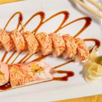 Angry Dragon · Hot and spicy. Shrimp tempura, mango,cucumber inside topped with spicy kani.
