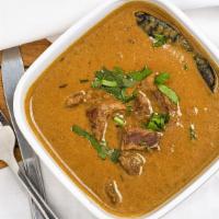Lamb Curry (Non-Vegetarian) · Tender lamb cooked with flavored Indian spices