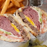 Liz'S Corn Beef Burger Combo · Corned beef, 1/3 beef patty, fried egg, Swiss and American cheese piled high on an onion rol...