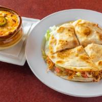 Southwest Quesadillas · Grilled flour tortilla with choice of chicken or shredded beef, lettuce, tomato, onion, and ...
