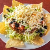 Taco Salad · Lettuce, ground beef, tomatoes, onions, olives, green peppers, cheese, and corn chips.