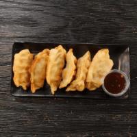 Crispy Shrimp And Pork Dumplings · Six fried to perfection dumplings filled with pork, shrimp, and chives paired with our spicy...