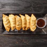 Crispy Vegetable Dumplings · Six fried to perfection vegetable dumplings paired with our spicy yuzu sauce.