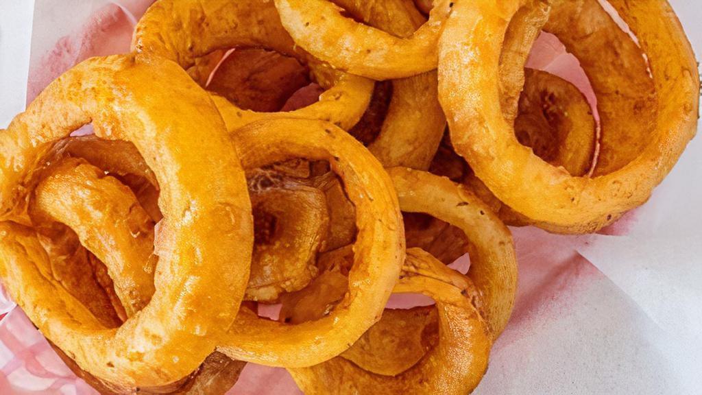 Onion Rings · Thick cut onion slices, double dipped in seasoned beer batter.