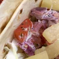 Fish Tacos · Two Smoked Tilapia Tacos with cabbage, fresh pineapple Pico & a honey lime mayo sauce served...