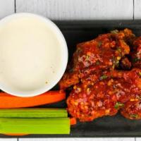 50 Wings · Choose up to 5 flavors and 2 dipping sauces. Carrots and celery included.