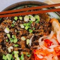 Bulgogi Beef W/White Rice · Tender shaved ribeye steak in a sweet sesame sauce tossed in garlic and sweet onions, topped...