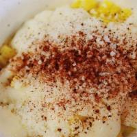 Elotes · Butter corn, mayo, cotija cheese, chili powder topped with cilantro in a cup