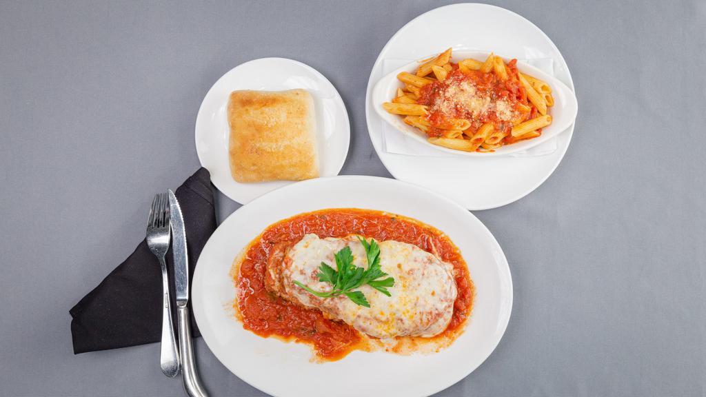 Eggplant Parmigiana · Fresh baked parmesan-breaded eggplant baked in our marinara sauce with mozzarella cheese served with a side of penne pasta with marinara.