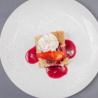 Italian Cheesecake · Made with whipped ricotta cheese, served with raspberries & raspberry sauce.