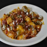Nacho Tot'S · Large Order of Tot's Topped with Plenty of Cheese, Bacon, and Jalapenos. Served with Boom-a-...