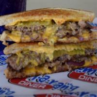 Ultimate Patty Melt · Two 1/4lb Patties, Triple Cheese,Grilled Onions, Mustard, Pickles on Grilled Wheat Toast