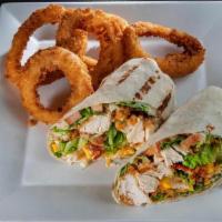 Fried Chicken Bacon Wrap · Hand Breaded Fried Chicken, Smoked Bacon Crumbles, Lettuce, Diced Tomatoes, Cheese Blend, an...