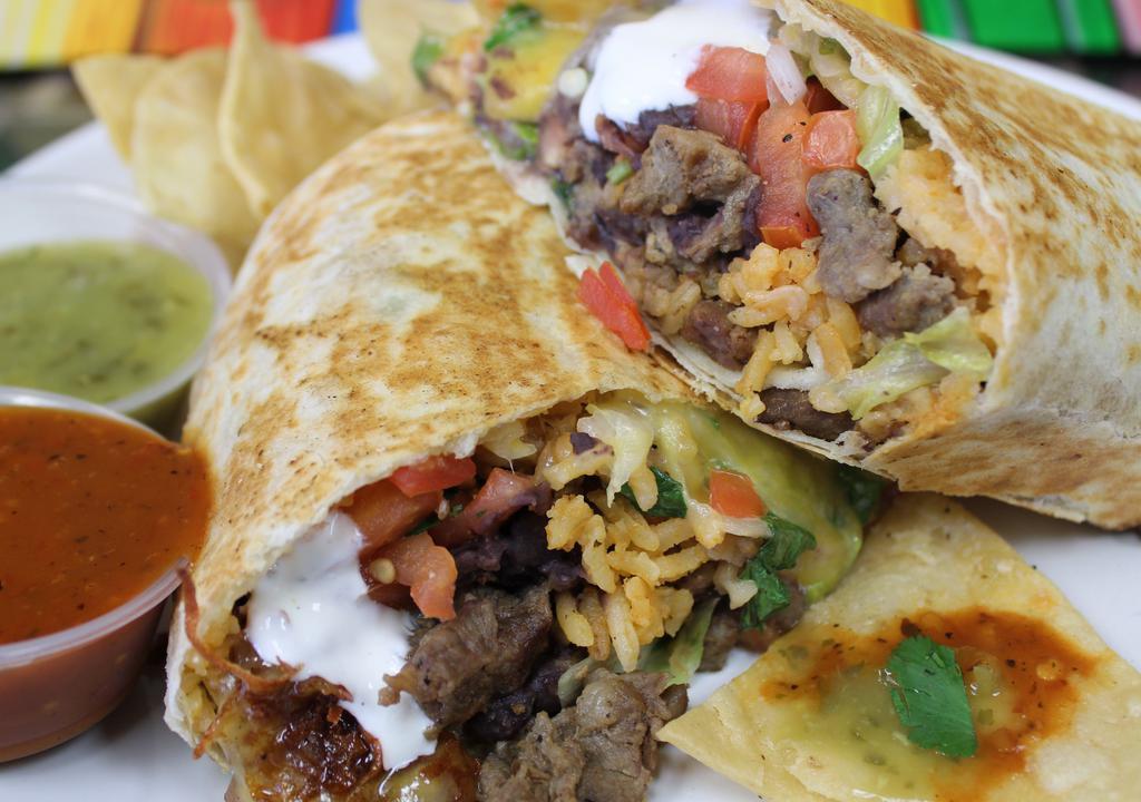 Burrito · Tortilla, meat, lettuce, pico, cheese mix, sour cream, rice, beans, chips, salsas.
