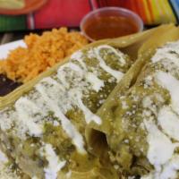 Tamales Platter · 2 tamales, green salsa, sour cream, queso fresco, rice, beans, red salsa.