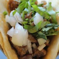 Street Taco · Corn tortillas, meat, cilantro, onion, lime, salsas.