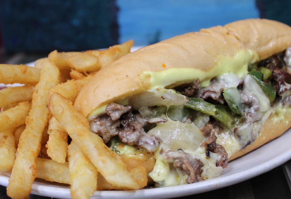 Philly Cheese Steak (Classic) · Turano bread, beef or chicken, fajita peppers, mustard mayo, American cheese, fries, green pepper, onion.