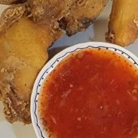 Spicy Chicken Wings (6 Pcs) · Deep-fried chicken marinated in sweet spicy sauce.