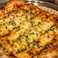 Cheesy Garlic Bread · Cheese, garlic oil, parsley flake, side of mariana sauce.