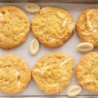 Lemon Cooler Cookie · Delicious all butter cookie made with coconut, white chocolate, and natural lemon flavor. Ch...