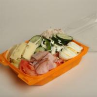 Chef Salad · Lettuce, tomatoes, green peppers, cucumbers, carrots, egg, ham, turkey, and American cheese.