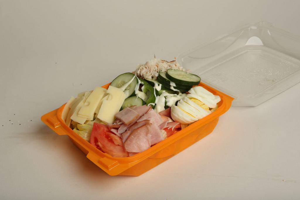 Chef Salad · Fresh-chopped iceberg lettuce topped with generous portions of tomatoes, green peppers, cucumbers, turkey, ham, hard-boiled egg, and american cheese with your choice of salad dressing.
