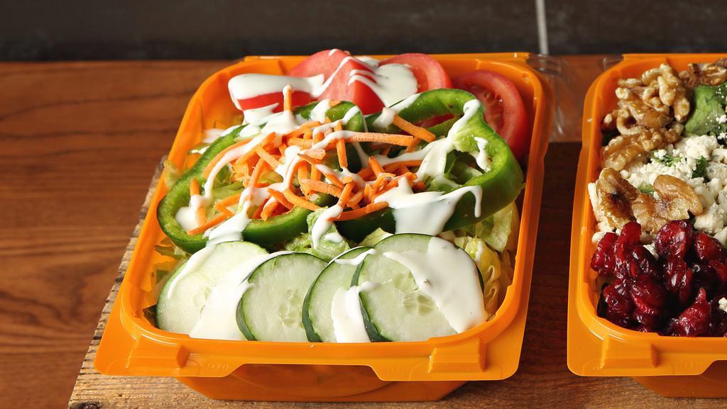 Garden Salad · Lettuce, Cucumbers, Tomato, Carrots, Green Peppers and American Cheese with your choice of dressing.