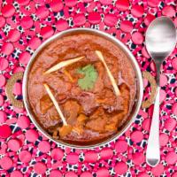 Goat Curry · Gluten-free. special Nepali entree goat meat on the bone cooked with gravy sauce and spices ...
