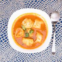 Chicken Jhol Momo · Chicken momo served with johl achar. (tomato-based soup)