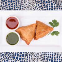 Samosa (2) · Vegan. deep-fried crispy pastry stuffed with mildly spiced potatoes and green peas.
