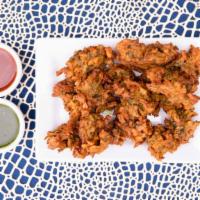 Onion Bhaji Pakora · Vegan, gluten-free. thinly sliced onion in with spiced potatoes and peas.